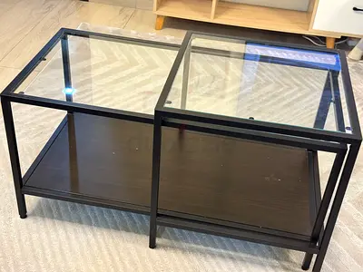 Ikea Pair of modern black metal and glass nesting coffee tables