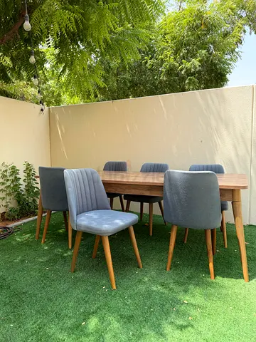 Wooden Dining Table with 6 Grey Upholstered Chairs - Good Condition one leg need repair .