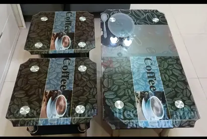 One Glass Top Coffee Tables with Coffee Print and two bed table for sale.Good condition.
