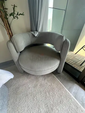 Light grey upholstered accent armchair in good condition