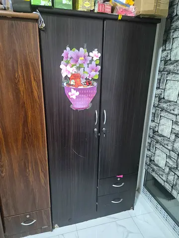 Two-door wooden wardrobe with bottom drawer - good condition