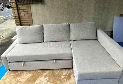 Beige L-shaped fabric sofa with storage, good condition