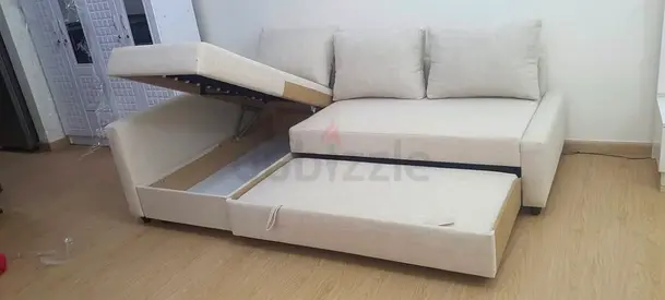 Beige L-shaped Sofa Bed with Storage — Good Condition