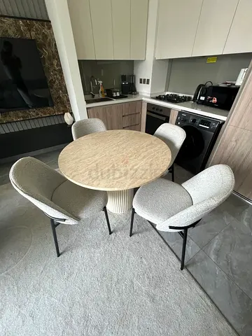 Round marble-top dining table with 4 upholstered boucle chairs - set