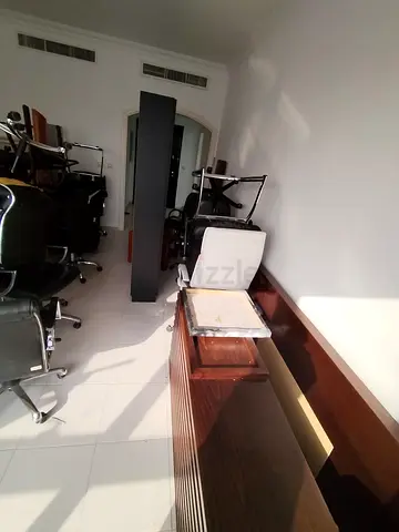 Assorted office chairs and wooden reception desk - used