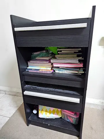 Small black wooden storage cabinet with drawers - good condition