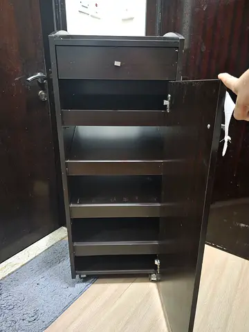 Black wooden shoe cabinet with 4 tilt-out compartments, good used condition