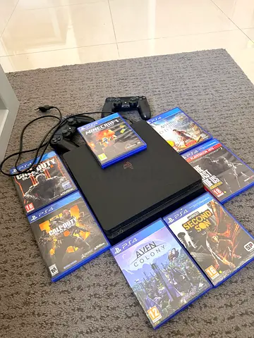 Sony PS4 Slim with 2 controllers and 7 games - Good condition
