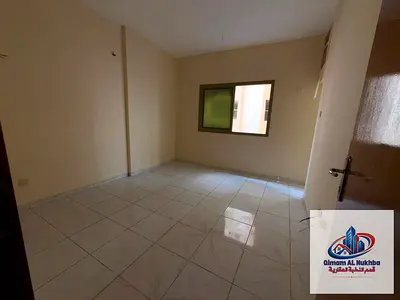 1BR apartment in Al Shuwaiheen with balcony and central gas, no AC, prime location, AED 24,000, 4 or 6 installments.
