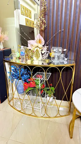 Console table .. golden colour with mirror top