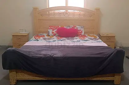 Solid wood king-size bed with two matching nightstands - good condition