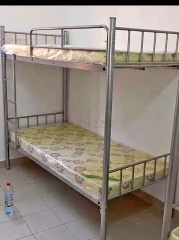 Sturdy Metal Bunk Bed with Two Mattresses - Good Condition
