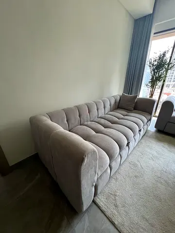 Light grey tufted 3-seater sofa cum bed in excellent condition