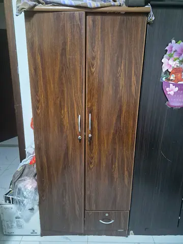 Two-door wooden wardrobe with bottom drawer - good condition