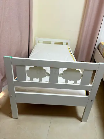 White wooden baby crib in good condition