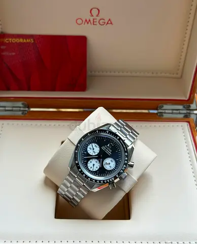 This Omega Speedmaster Professional "Reverse Panda" features a black lacquer dial with white sub-dia