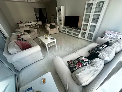 White Entertainment Center with Matching Glass Cabinet and Shelving