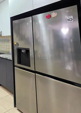 LG Stainless Steel Side-by-Side Refrigerator with Water Dispenser