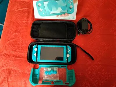 nintendo switch lite almost new with maicro sd card 128G🪩(the price include the accessories