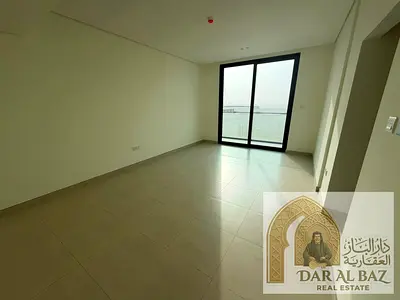 Two-bedroom apartment with a living room for annual rent in Al Zahia, located in a new building. Spacious layout, balcony with open views, swimming po
