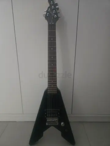 Mini black guitar, includes a bag
