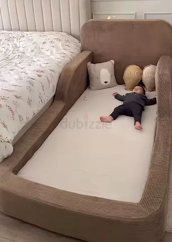 Low bedside toddler bed / co-sleeper — soft padded side rail design