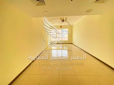 Two bedroom apartment in Al Qasimia area for annual rent Spacious with free parking and gym access Central air conditioning panoramic views