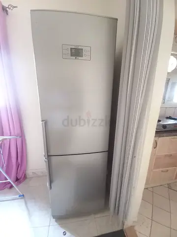 Silver freestanding refrigerator with freezer bottom - good condition