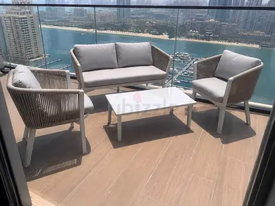 Outdoor 4-piece patio seating set with coffee table — great condition - removable cushions covers