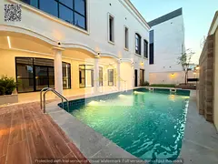 Luxury villa with custom finishing, swimming pool, elevator, and terrace in Al Zahia area, Ajman. In
