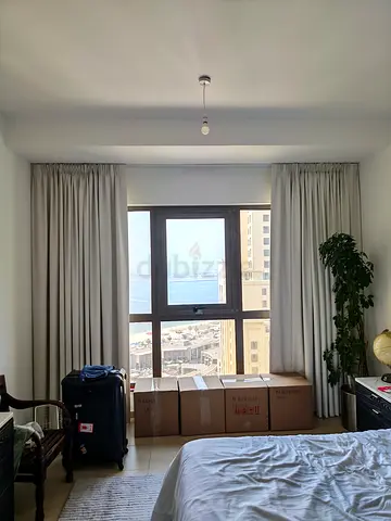 Light grey full-length blackout curtains, ready to hang