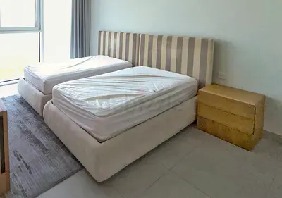 Two single beds with headboards and mattresses - good condition. 1 residences al kifaf