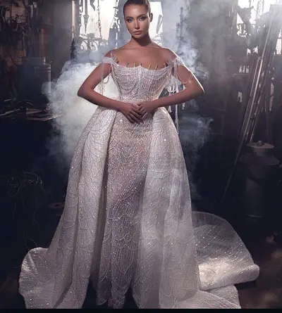 Embellished off-shoulder bridal gown with detachable overskirt