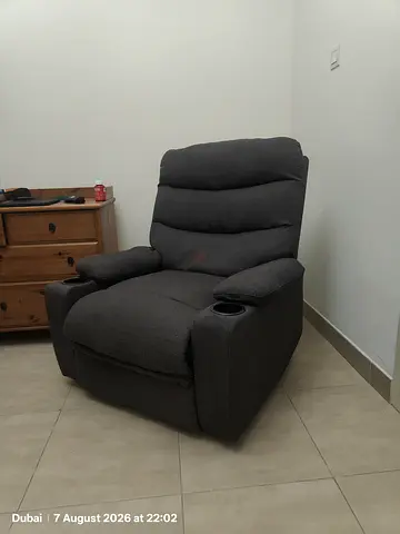 Dark grey fabric single recliner armchair with cup holders - good condition