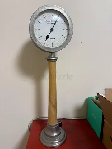 Vintage-style indoor thermometer on wooden stand