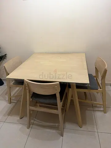 Light wood dining table with three chairs - minimalist set