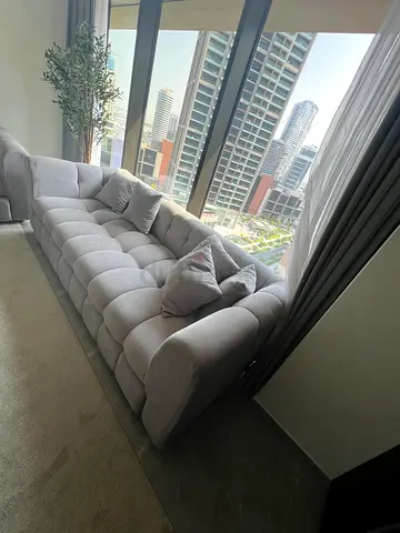 Light grey 3-seater tufted fabric sofa cum bed in excellent condition