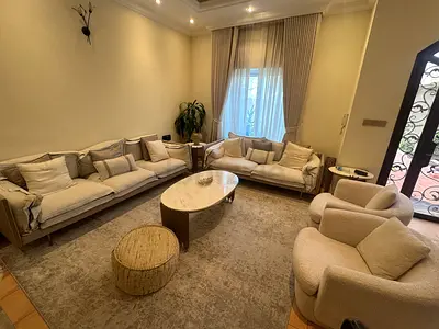 Living room sofa set with armchairs and coffee table