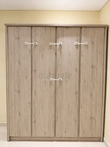 Light wood 4-door wardrobe / armoire in good condition