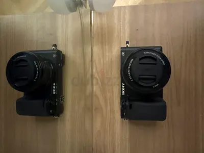 Sony Alpha A6400 mirrorless cameras with lenses and grips - used