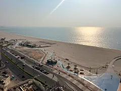 Two bedrooms, a living room, three bathrooms, a balcony, central air conditioning, Ajman Corniche, b