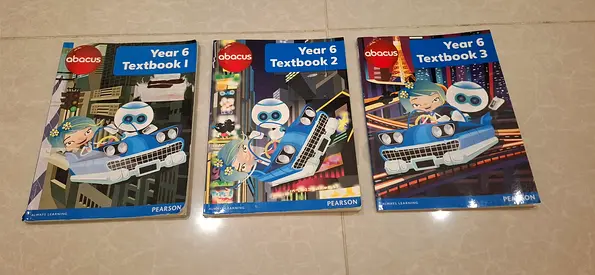 Set of 3 Year 6 Pearson Math Textbooks (Textbook 1, 2 & 3) - Pearson Textbook 1 is solved.