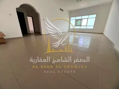 The finest one bedroom apartment with a living room featuring a huge layout built in wardrobes modern finishing and a prime location in Al Butinah
