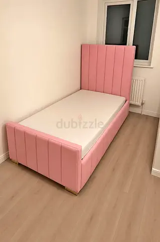 Single Pink Upholstered Bed with Headboard and Mattress