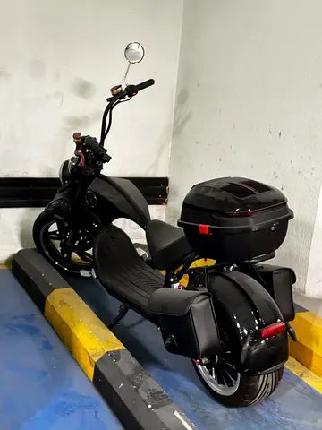 Black electric scooter with top box and side bags - good condition