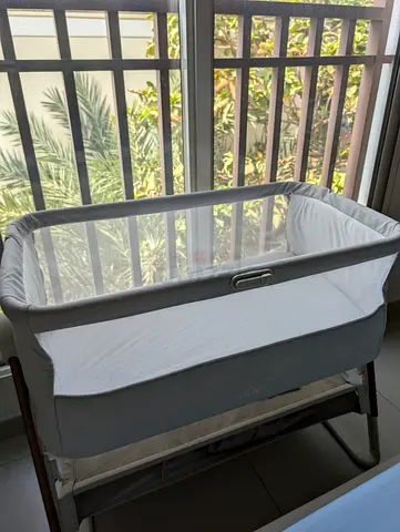 Side-sleeping bedside bassinet in grey — gently used