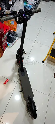 Used electric scooter — decent condition, runs well