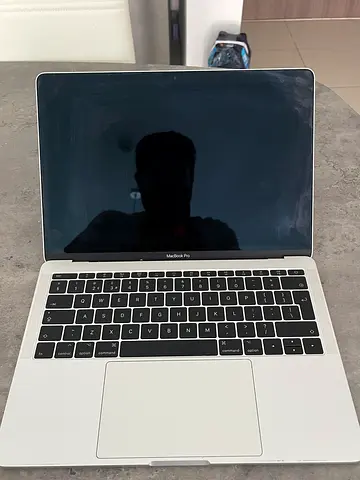Used silver MacBook Pro, working condition, Battery needs replacement