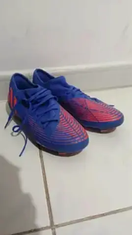 Blue and red men's football boots, size not specified - used