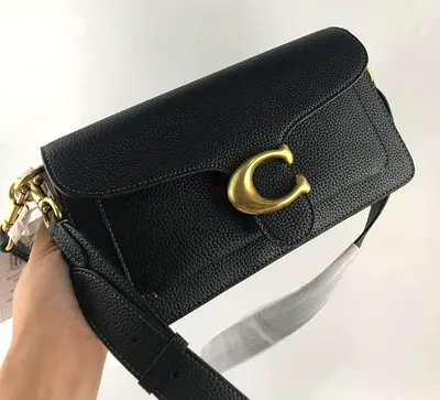 Black pebbled leather shoulder bag with gold-tone 'C' clasp